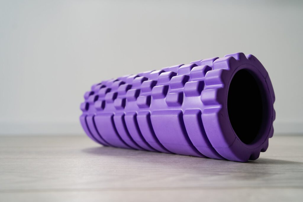 purple,textured,foam,roller,for,body,massage,on,the,light